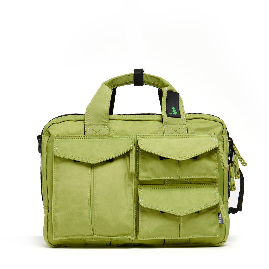 Mueslii classic 3 ways that can be used as backpack a shoulder bag or a briefcase, color  pistachio green, padded laptop compartment.
