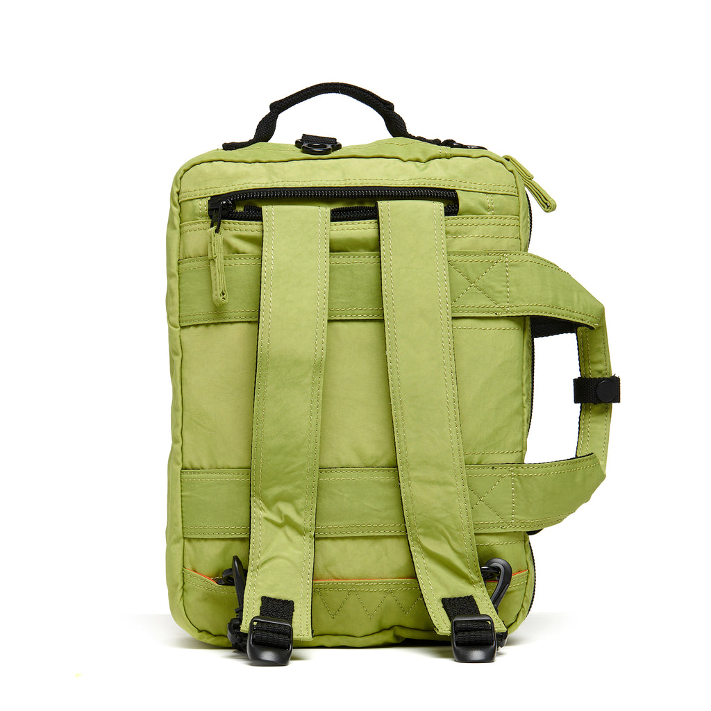 Mueslii classic 3 ways that can be used as backpack a shoulder bag or a briefcase, color pistachio green, back side.