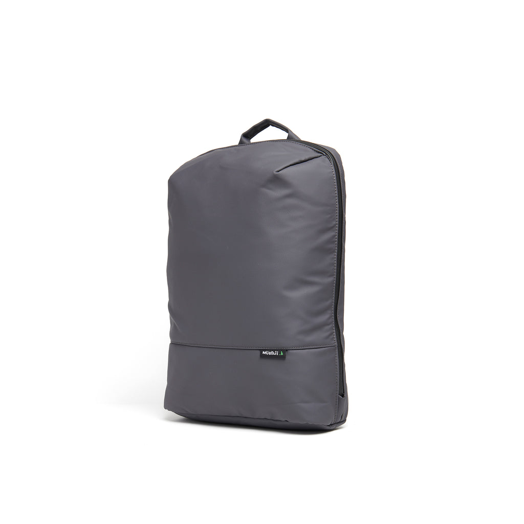 Mueslii small backpack, made of PU coated waterproof nylon, with a laptop compartment, color slate grey, side view.