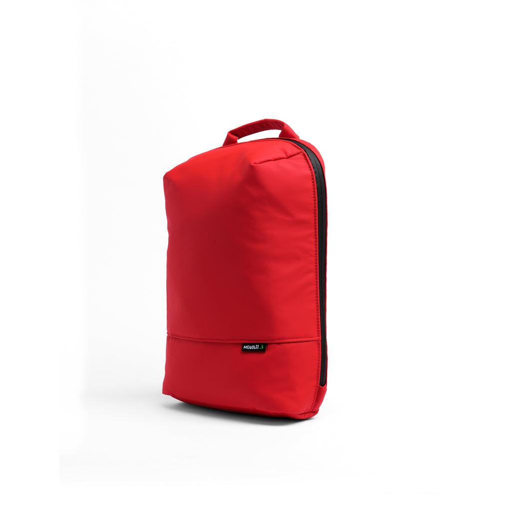Mueslii small backpack, made of PU coated waterproof nylon, with a laptop compartment, color coral red, side view.