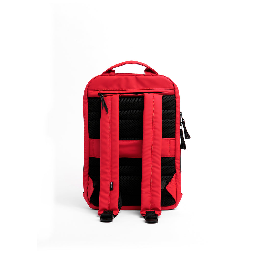 Mueslii small backpack, made of PU coated waterproof nylon, with a laptop compartment, color coral red, back view.