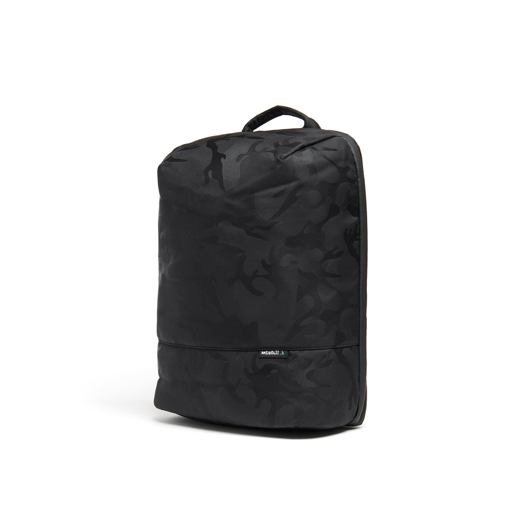 Mueslii travel backpack, made of waterproof jacquard nylon, camouflage pattern, with a laptop compartment, color black, side view.