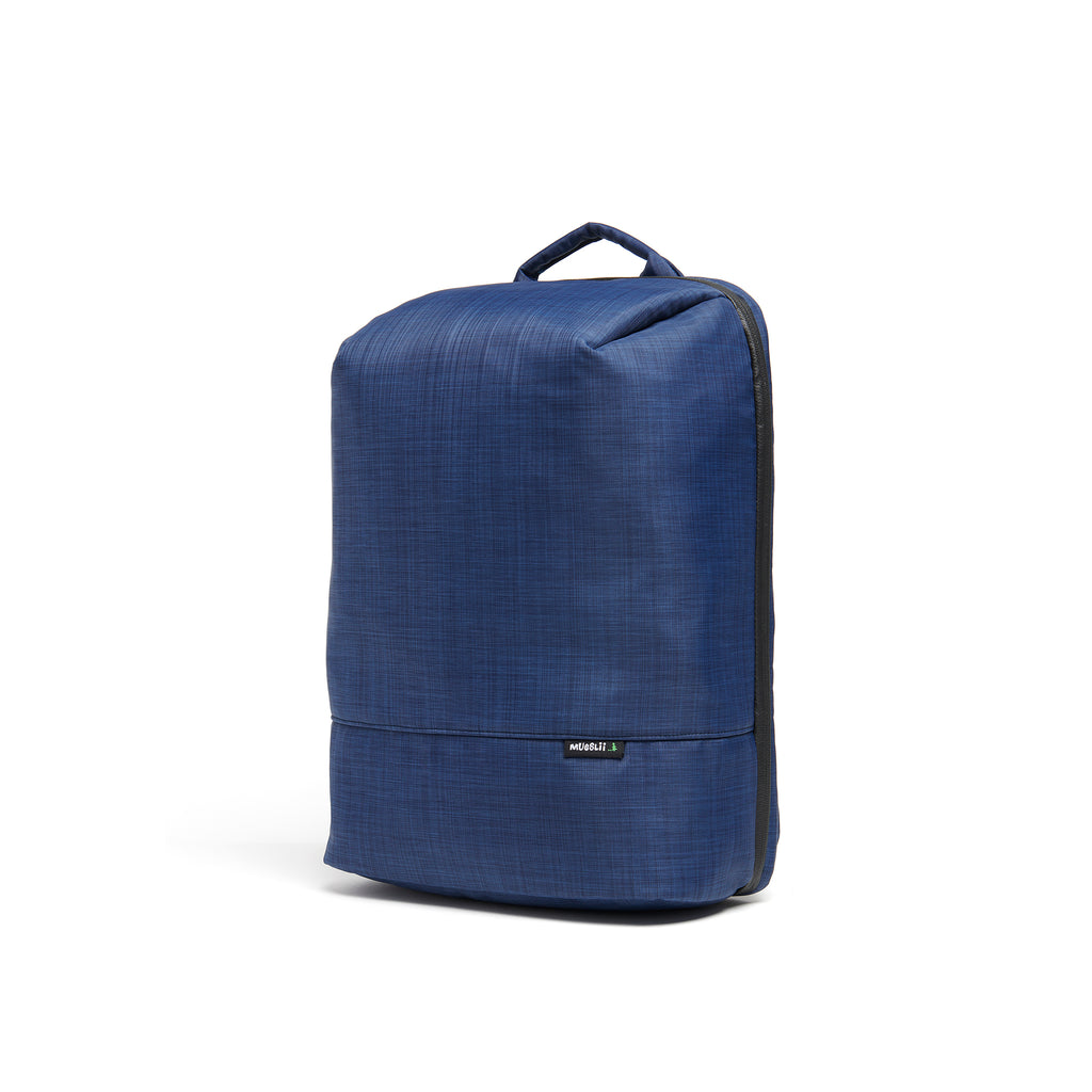 Mueslii travel backpack, made of water resistant canvas nylon, with a laptop compartment, cabin luggage, color ocean blue, side view.
