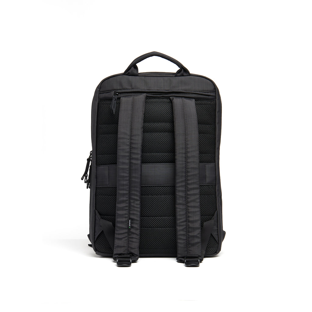 Mueslii daily backpack, made of  water resistant canvas nylon, with a laptop compartment, color black, back view.
