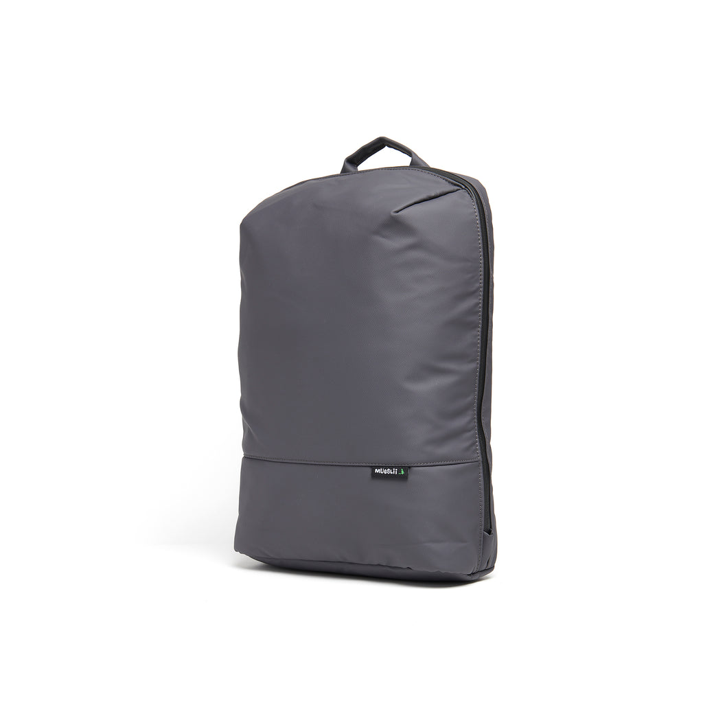 Mueslii daily backpack, made of PU coated waterproof nylon, with a laptop compartment, color grey, side view.