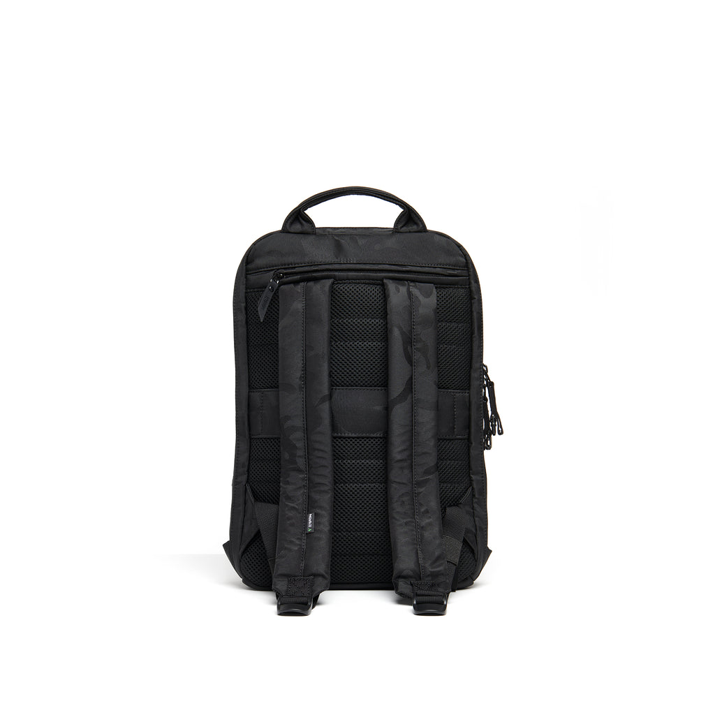 Mueslii small backpack, made of jacquard  waterproof nylon, camouflage pattern, with a laptop compartment, color black, back view.