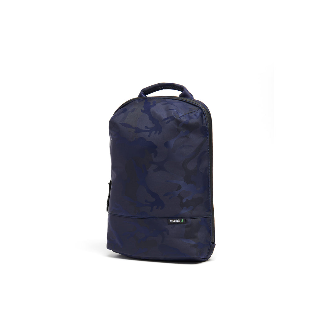 Mueslii small backpack, made of jacquard  waterproof nylon, camouflage pattern, with a laptop compartment, color blue, side view.