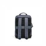 Mueslii small backpack,  made of  water resistant canvas nylon,  with a laptop compartment, color slate grey, back view.