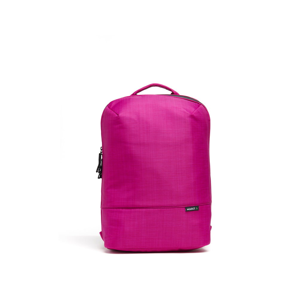 Mueslii small backpack,  made of  water resistant canvas nylon,  with a laptop compartment, color fuchsia, front view.