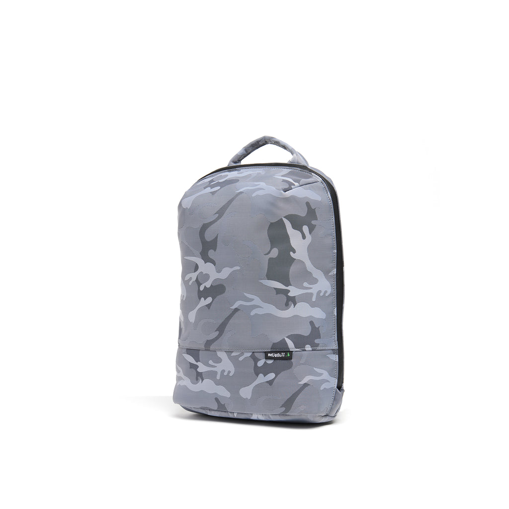 Mueslii small backpack, made of jacquard  waterproof nylon, camouflage pattern, with a laptop compartment, color silver, side view.