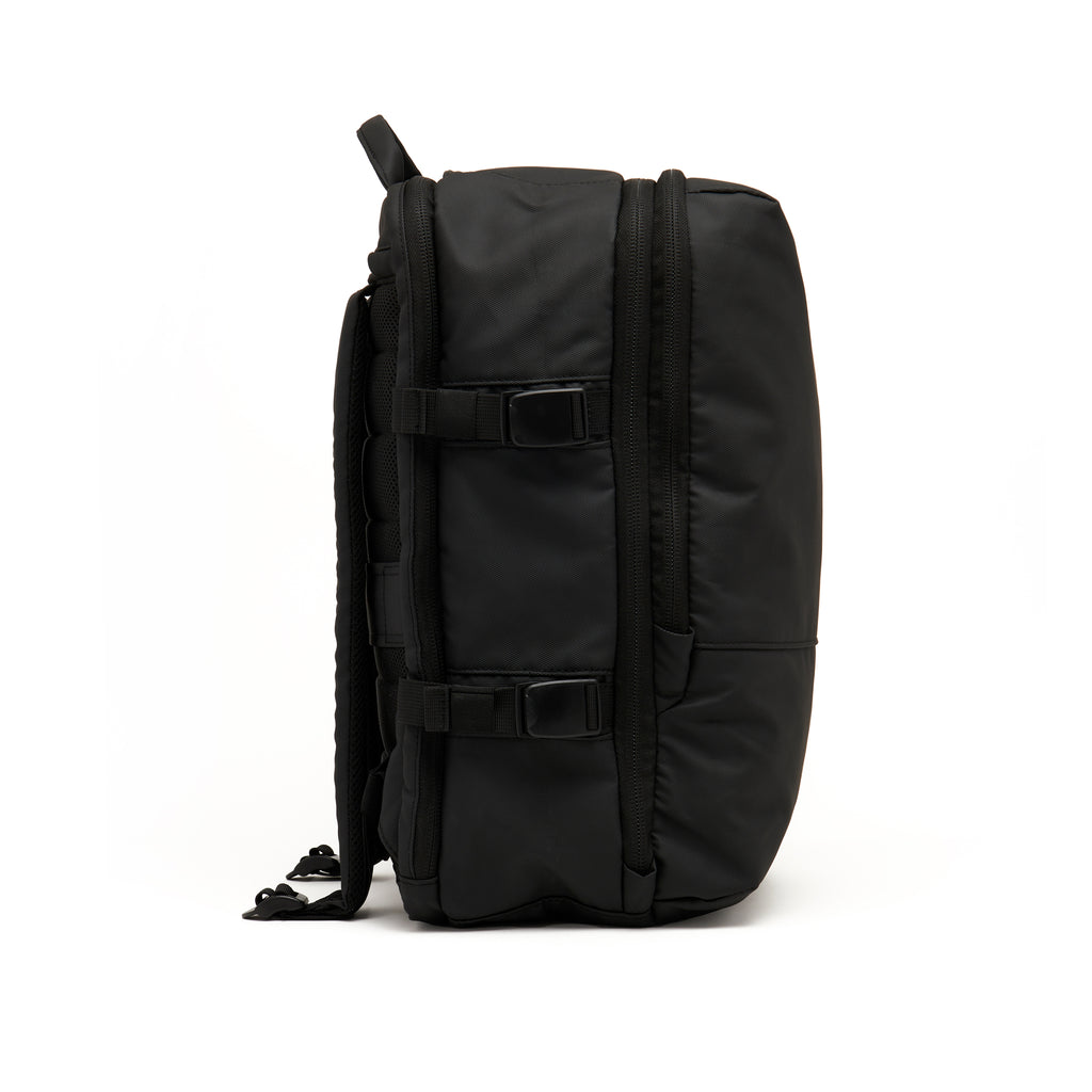 Mueslii travel backpack, made of PU coated waterproof nylon, color black, side view.