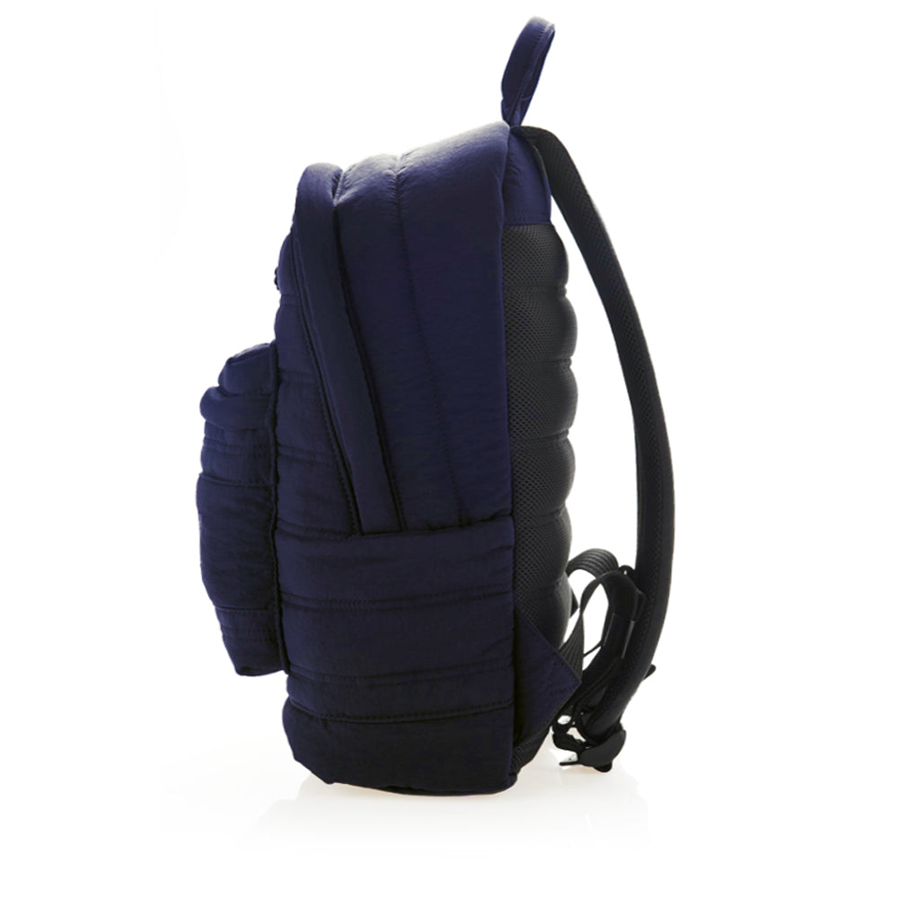 Daily backpack made with crinkle nylon, designed to keep your laptop (max 15”) safe and cushioned. Color Blue, side view, limited edition.