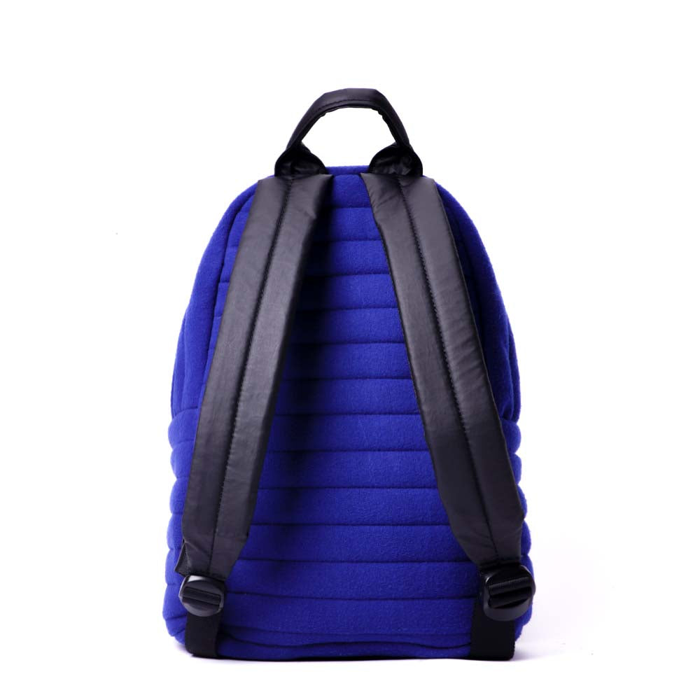 Mueslii original puffer small backpack made of woven cloth and Ykk zips, color blue, back view.