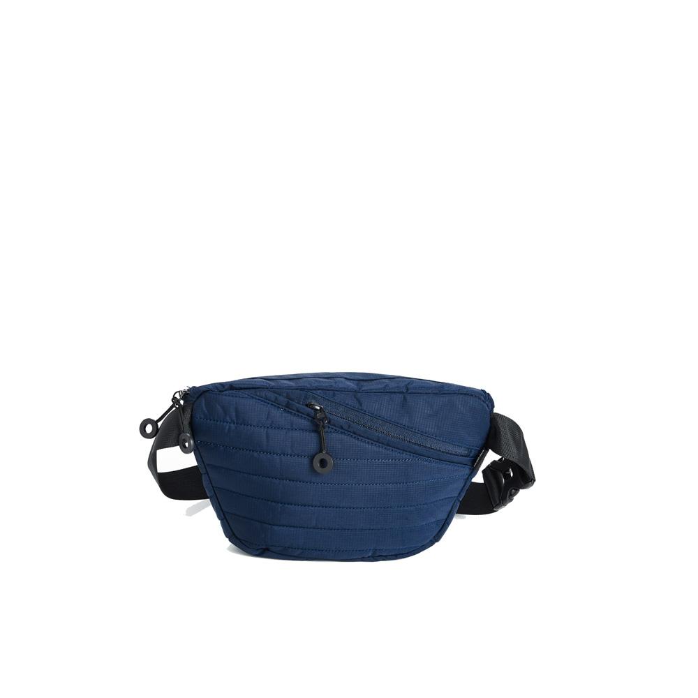 Mueslii puffer waist bag, made of high density nylon and Ykk zips, color blue, back view.