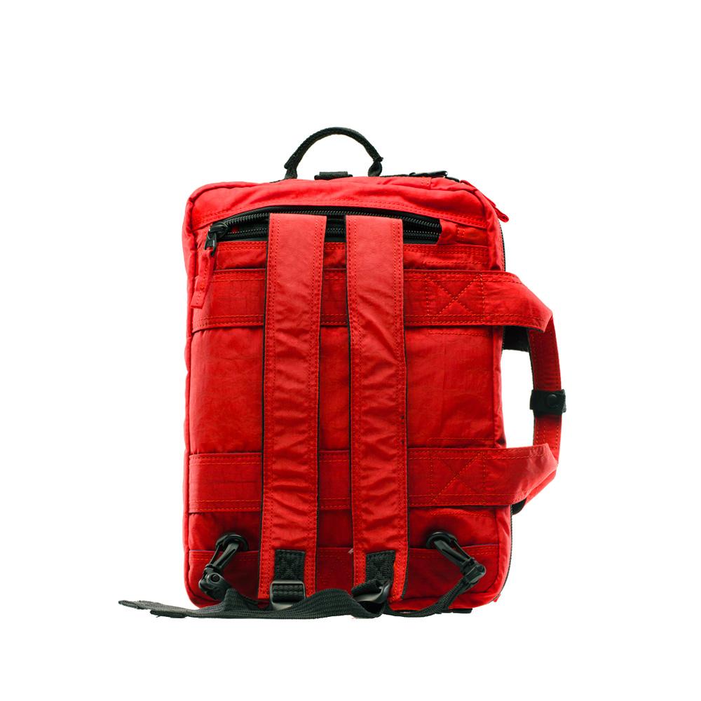 Mueslii classic 3 ways that can be used as backpack a shoulder bag or a briefcase, color lava red, back side.