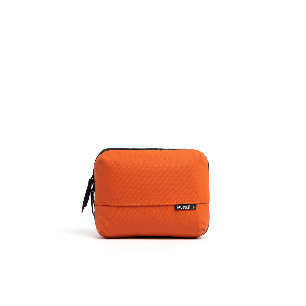 Mueslii tech case, made of PU coated waterproof nylon, color burnt orange, front view.