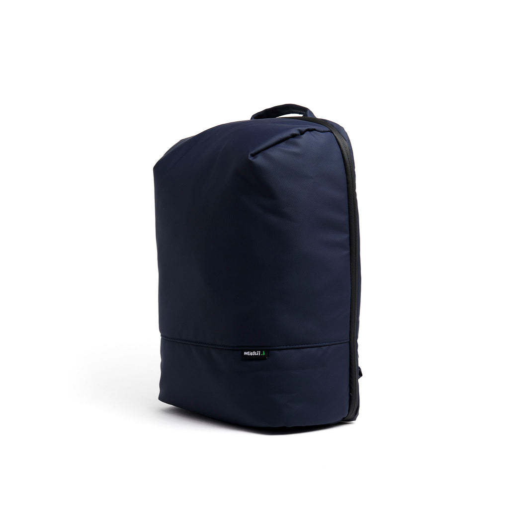 Mueslii travel backpack, made of PU coated waterproof nylon, with a laptop compartment, color blue, side view.