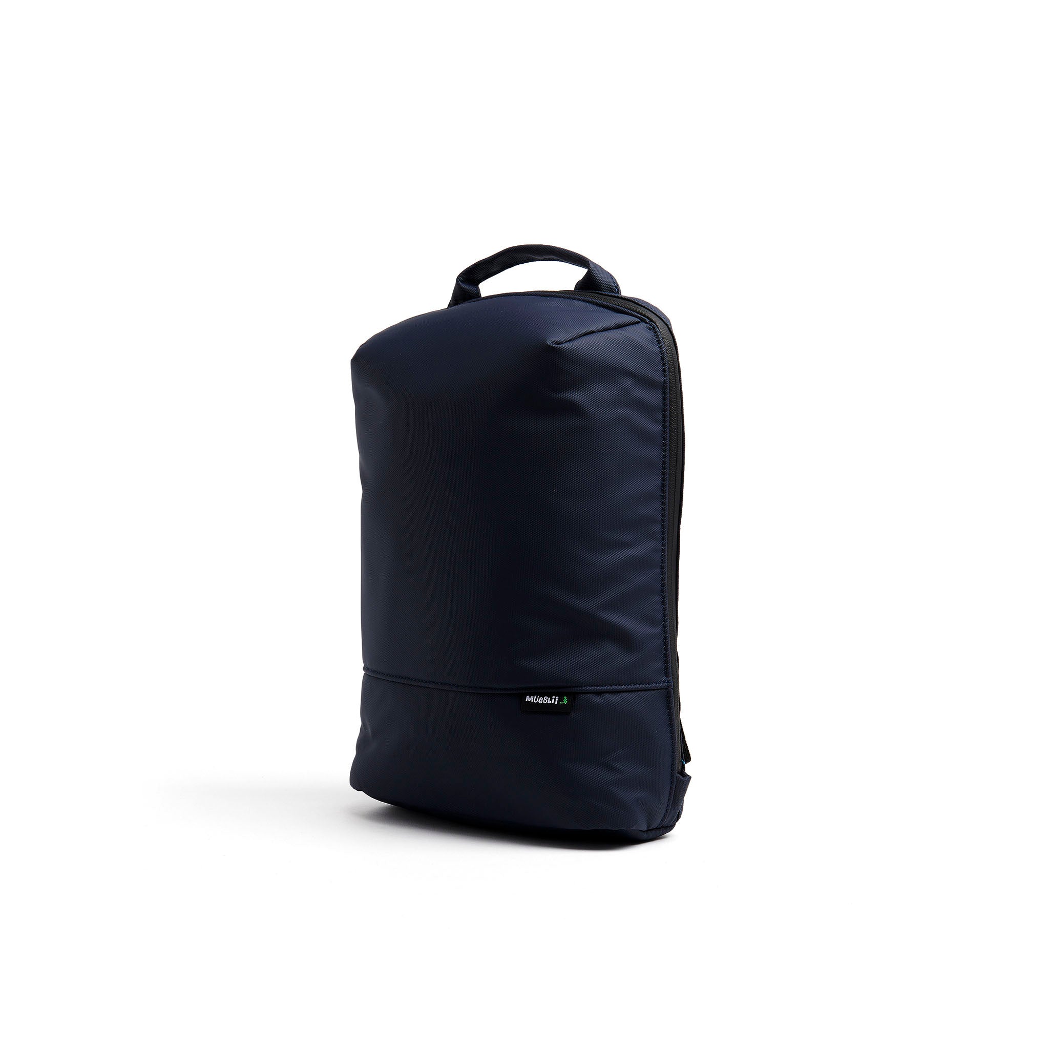 Mueslii small backpack, made of PU coated waterproof nylon, with a laptop compartment, color midnight blue, side view.