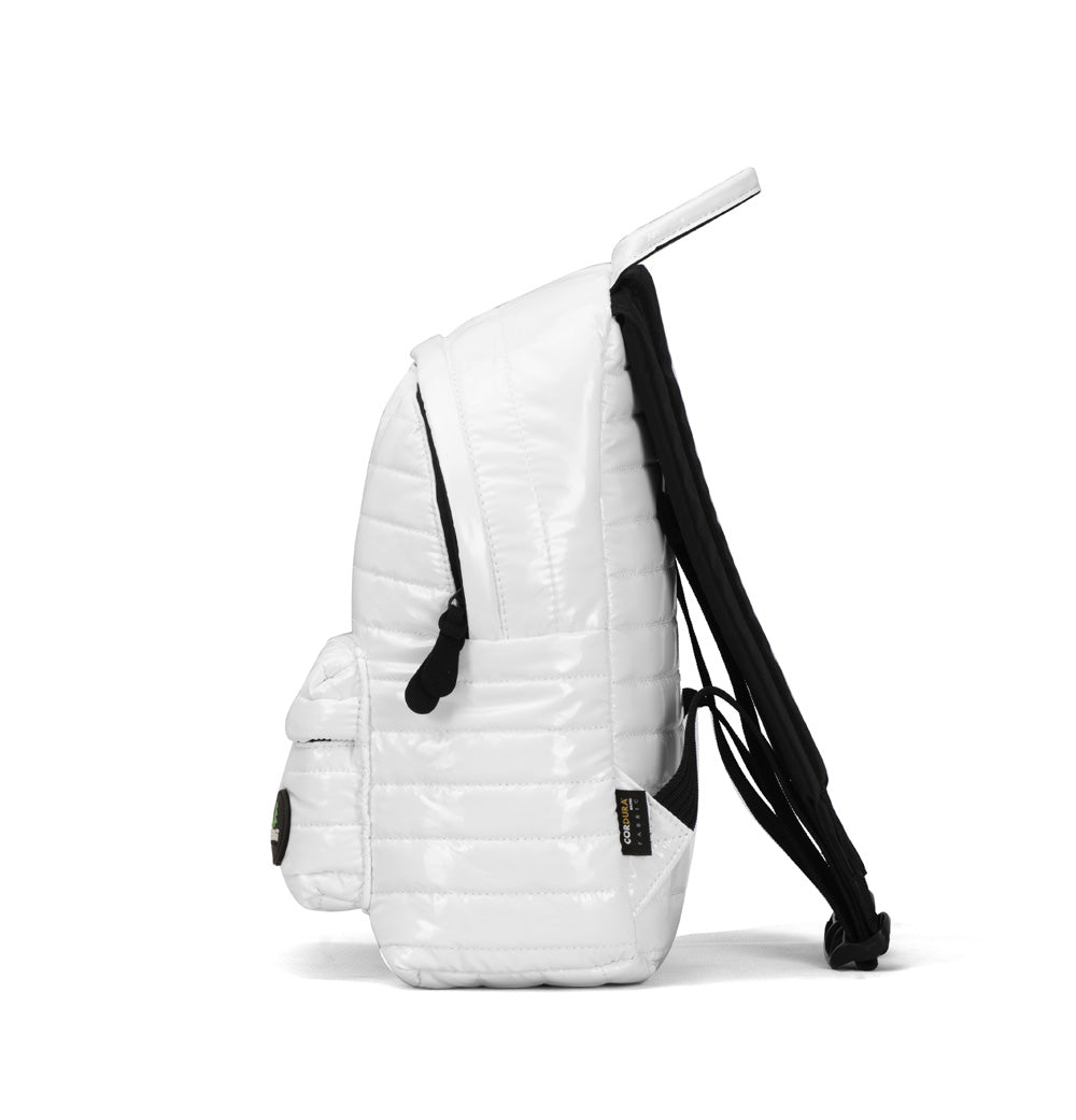 Mueslii original puffer medium and small backpack made of metal coated nylon and Ykk zips, color white, side view.