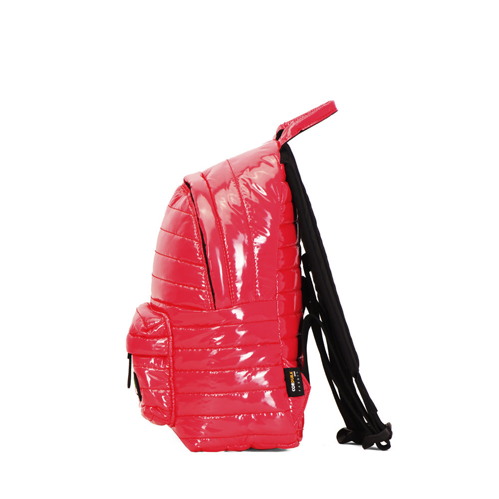 Mueslii original puffer medium and small backpack made of metal coated nylon and Ykk zips, color pink red, side view.