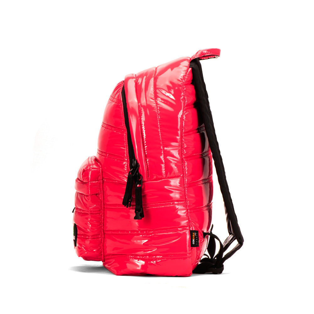 Mueslii original puffer daily backpack made of metal coated nylon and Ykk zips, color pink red, side view.