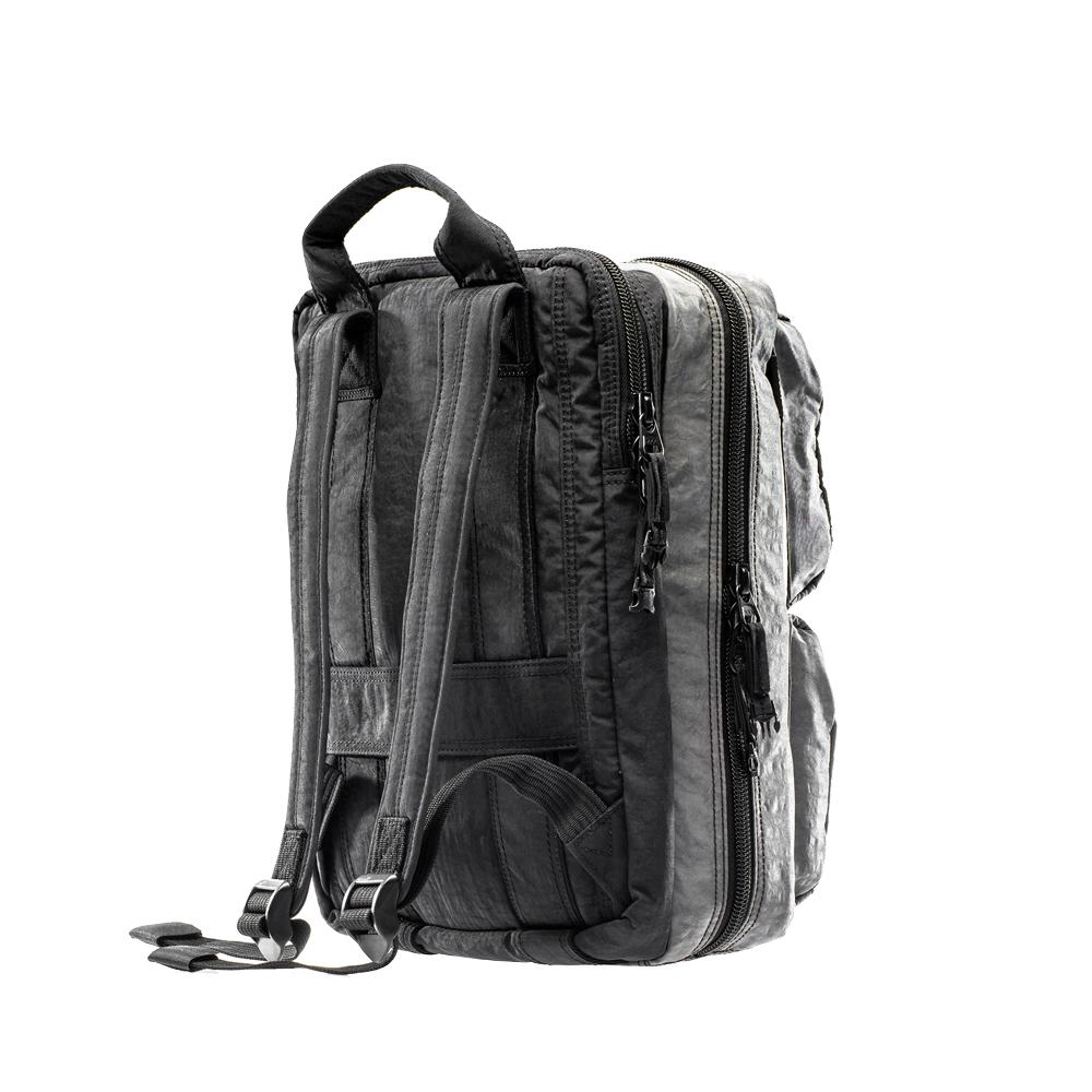 Mueslii travel backpack with separate clothes and laptop compartments, capacity 19 liters.