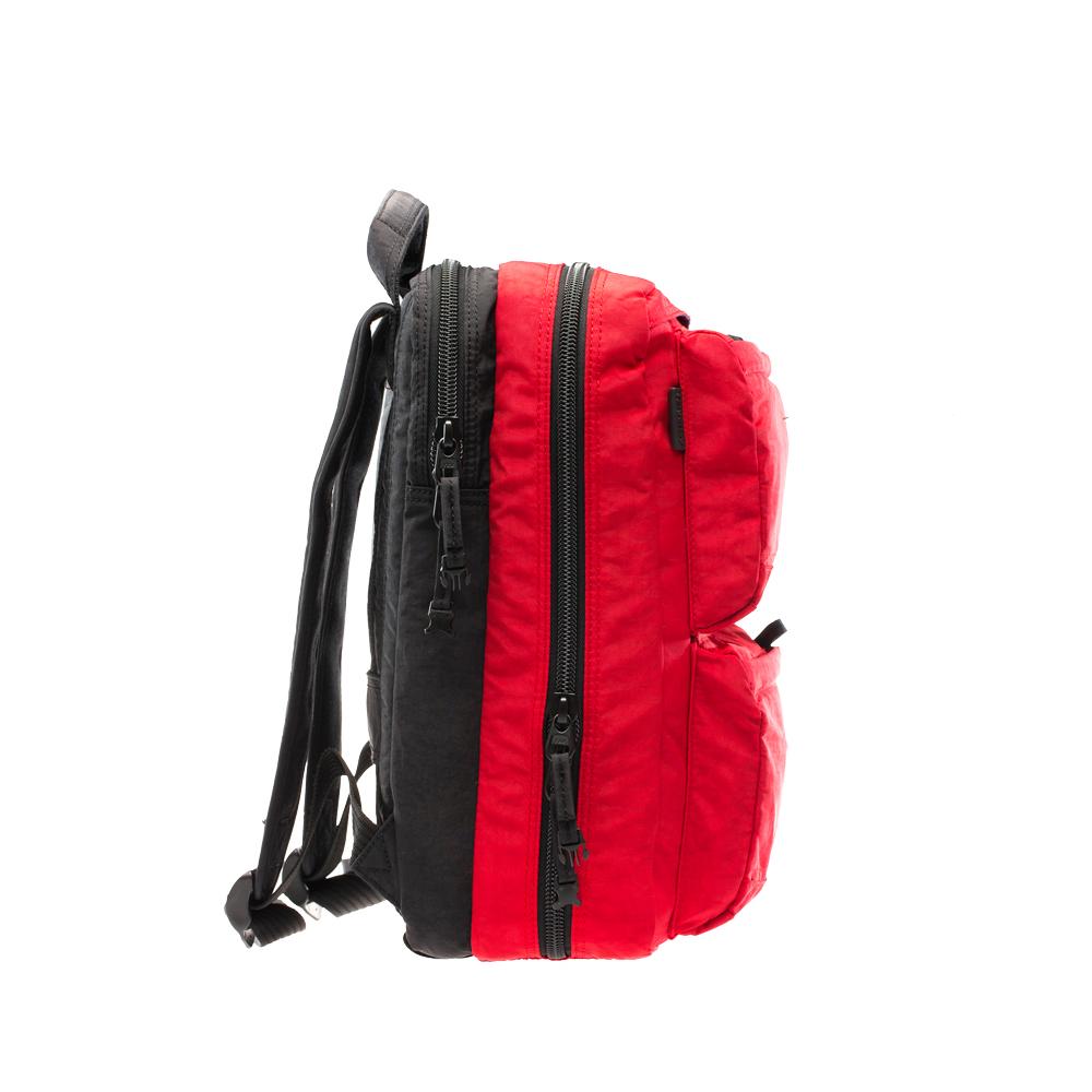 Mueslii travel backpack with separate clothes and laptop compartments, color lava red, security fastening clip.