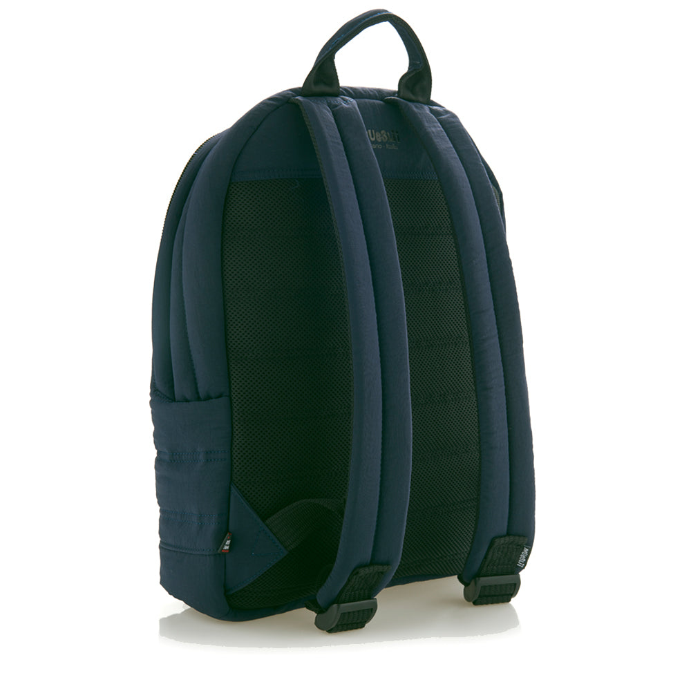 Mueslii original puffer laptop backpack made of high density nylon and Ykk zips, color matte blue, back view.